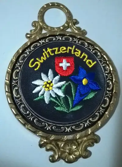 Vintage Brass Leather Embroidered Flower Switzerland Souvenir, 5 inches height x 3 1/4 inches diamet...