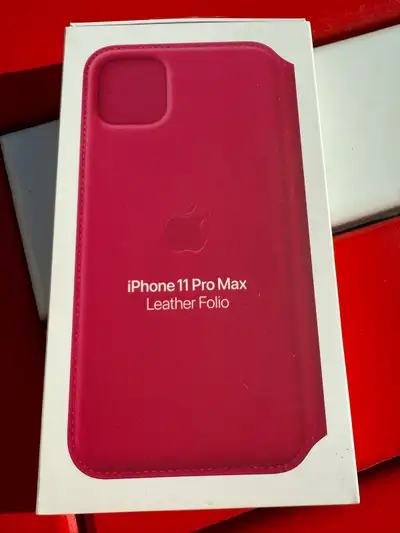Original packaging and from Apple, iPhone 11 ProMax leather folio case in berry/red. Contains two in...