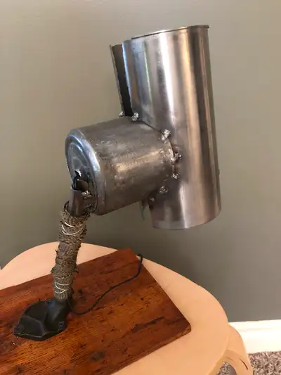 This is a one of a kind lamp made from new and used heavy equipment parts. The lamp was made out of...