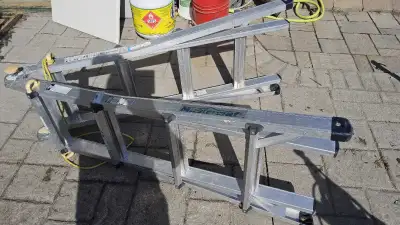 This is a used Mastercraft aluminum telescopic A-frame ladder, extending up to 17 feet, perfect for...