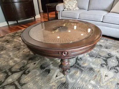 Maya round coffee table. Handwoven cane. solod wood, glass top. 43" Round x 18" H See instructions b...