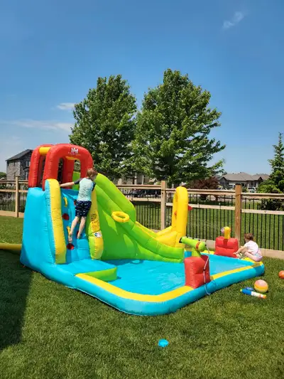 Selling our bounce house with water slide and air blower. Kids outgrew it and no longer use. Pool ar...