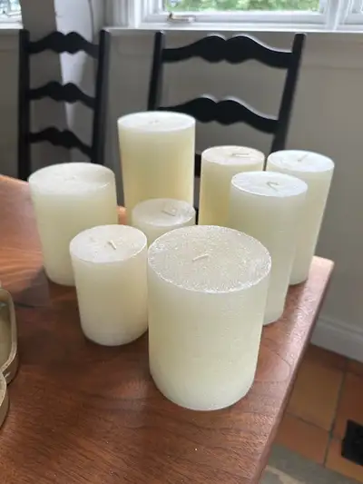 Assorted wax candles (new). There are 7", 6", 5" and 4" with varying diameters as seen in the photos...