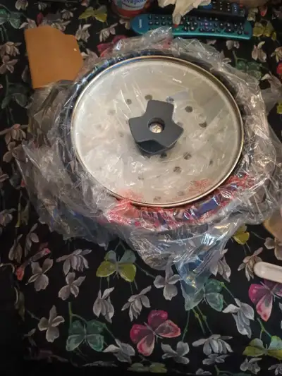 Brand new in box, Mini Rice cooker And veggie Steamer, ladle and measuring cup with manual included,...