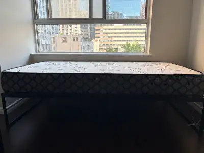 Selling a twin XL bed frame paired with a mattress, ideal for students or smaller spaces. This set h...