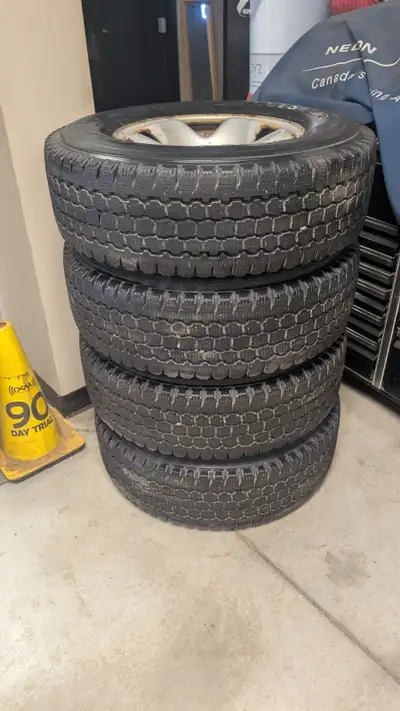 Set of 4 Bridgestone Blizzak W965 tires on rims. 90% Tread. Off of Toyota Tacoma.