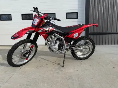 Beautiful Honda CRF 250F with graphics package and upgraded seat. New condition, has approx 10 hours...