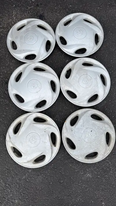 I'm offering a set of six used Toyota hubcaps, perfect for replacing damaged or missing wheel covers...