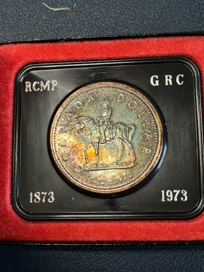 1973 Canada Silver dollar RCMP with toning, View more
