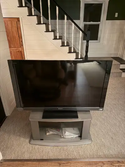 Sony 46” screen TV with stand and remote., View more