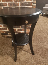 Black round wooden table