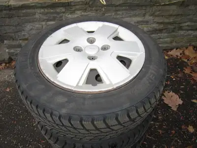 Please phone 519-744-4175 for directions Winter tires on rims, balanced with hub caps Two winters ol...