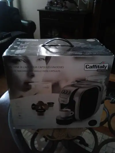 for sale caffitaly coffee maker with 16 pods. This machine was given as a gift but was never opened....