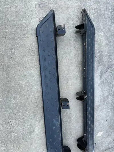 These are a pair of OEM running boards removed from a 2021 Toyota Tundra . These running boards are...