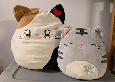Squishmallow medium sized calico cat $12 Squishmallow small sized grey tabby cat $8 Take both for $1...