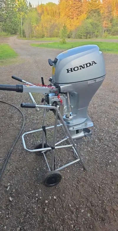 Honda 15 hp short shaft outboard excellent condition low hours with tank and hose. Manual start and...