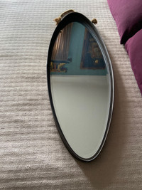 Oval shaped metal frame mirror 35.5 L by 12.5 D 