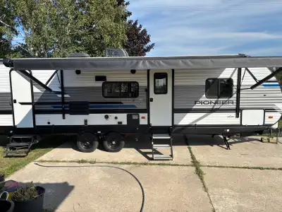 Well-maintained and lightly used 2021 Heartland Pioneer BH270 bunkhouse travel trailer. This is a gr...