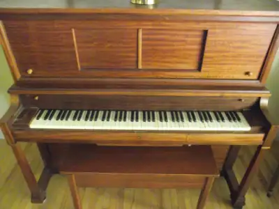 Player Piano (Willis/Sterling} with over a hundred rolls. Comes with bench(with storage) and storage...