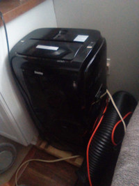 Air conditioner/humidifier/heater a stand-up 
