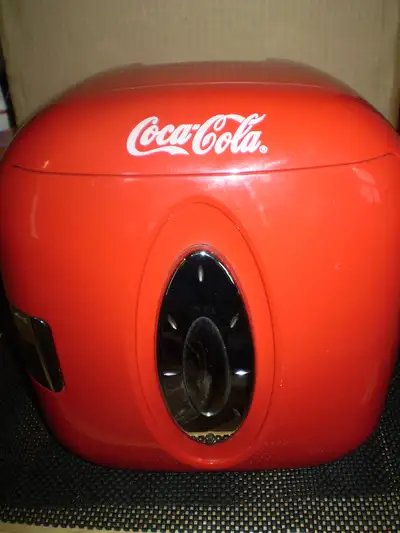 NO TEXT Cute cooler that looks like a fridge. COCA COLA in stylised graphics on top front. Will keep...