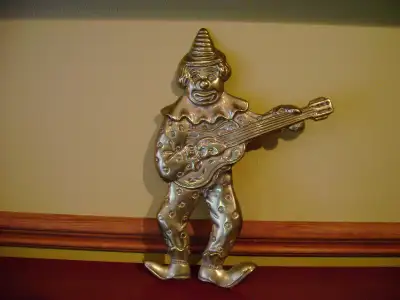 Brass wall art. Clown themed hanging., View more