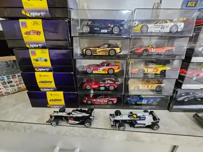 Massive slot car set. 1 power base with 2 power supplies. Most cars in pristine condition and never...