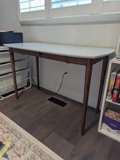 White top, dark brown wood legs. One drawer. Simple design, great for small spaces. Minimalist style...