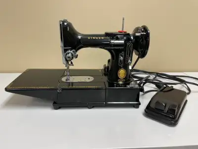 This is a rare, vintage Singer sewing machine, a true gem for collectors and sewing enthusiasts alik...