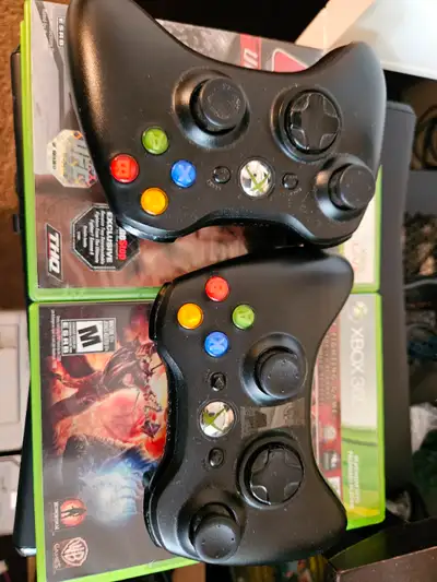 XBox 360s 250GB.. gently used 2 controlls + games in pic $80