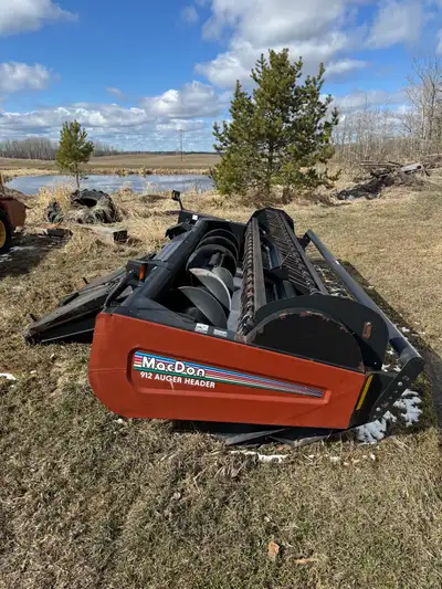 Mac Don hay header for sale, only 400 acres on it since all bearings were replaced, new wobble box i...