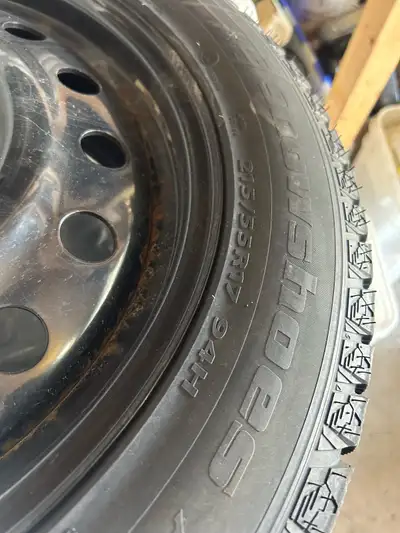 Offering a set of winter tires, size 215/55R17, mounted on steel rims with a 5x114.3 bolt pattern. T...