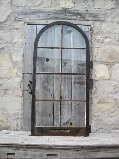 Fancy 8 pane wooden storm window with round top. Second picture shows opposite side. 35 x 72
