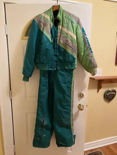 I have a two piece 1990 MEDIUM arctic cat snow pro snowmobile suit in fair condition! Will fit anyon...