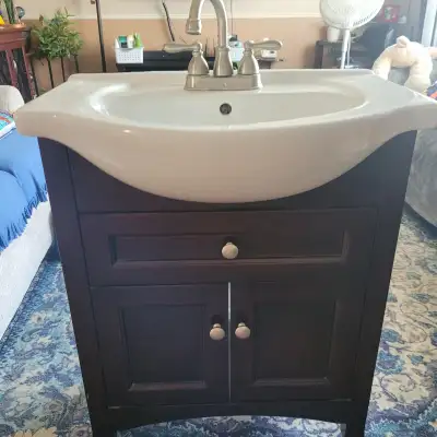 Beautiful espresso colour vanity bathroom cabinet with porcelain sink. Includes chrome faucet. Soft...