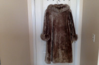 Mouton fur coat trimmed with arctic fox fur.