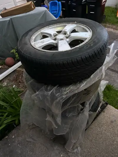 Reliable set of OZZO 215/60R16 tires. Tires are mounted on rims. Tread depth is good, as shown with...
