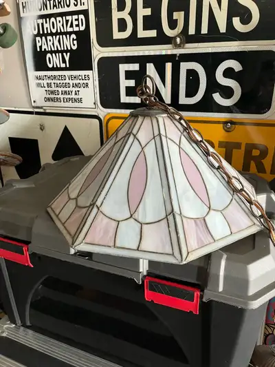 Add a touch of vintage charm to your home with this used stained glass hanging light fixture, featur...