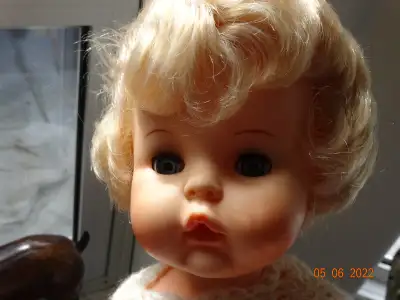 Such a lovely face and hair is thick and nicely styled. Good condition toddler . Blue eyes, open mou...