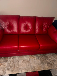 Red leatherette pull out sofa