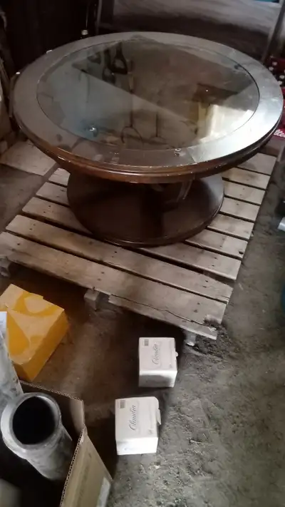 It has wheels at the bottom to move it around. And the glass circle thingy can come off. $10 cash an...