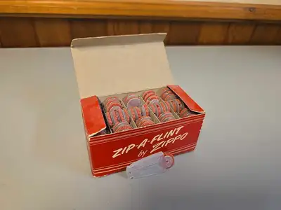 This RARE Vintage 1950's Zippo Zip-A-Flint Flint Dispenser is a true collector's gem. With 45 pieces...