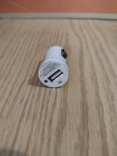 Excellent condition cigarette lighter plug in to USB charger adapter for charging a phone in your ca...