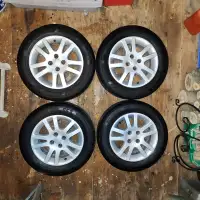 Four 185/65R15 Motomaster SE3 Tires on Honda Rims