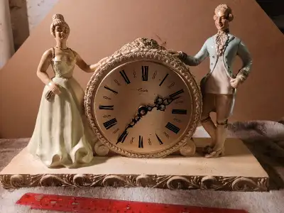Victorian style clock $20 Vernon Sealy doll $25 Brass containers $20 each Fan $20...spreads out to a...