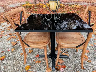 Black Restaurant Table measures 24" x 30" and is 30"H. The chairs are new. This is a cute set for an...
