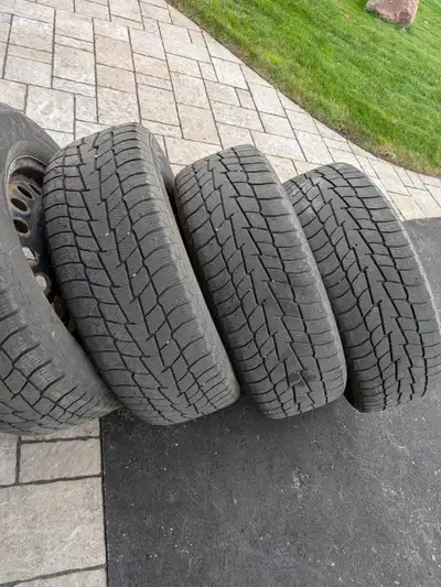 17" steel rims and winter tires. Lug nuts included. Tread depth still in the green. Asking $300. 613...
