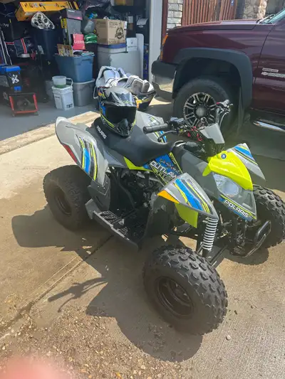 2017 Polaris Outlaw 110. Great used condition with new battery and matching helmet. Very little use....