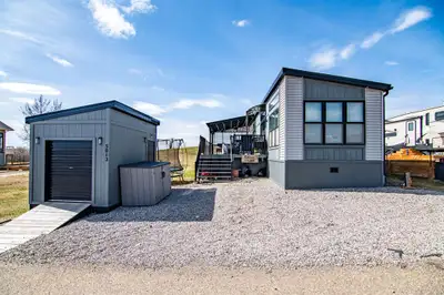 Contemporary Park Model with Stunning Golf Course & Lake Views – Turnkey & 4-Season Ready! Discover...