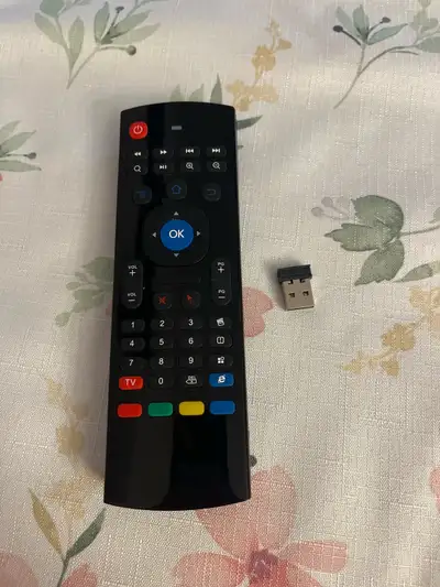 Enhance your smart TV or computer setup with this used MX3 air mouse featuring a QWERTY keyboard on...